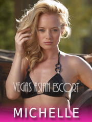 Enjoy the Fun of Vegas Las Vegas escort Asian girl with blonde hair poses for the camera in a bikini top.